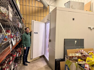 At Father Carr&rsquo;s Place 2B, Jim Boehm showcases the Barr, Inc. walk-in freezer provided to support increased food storage needs as part of Coolers for a Cause.